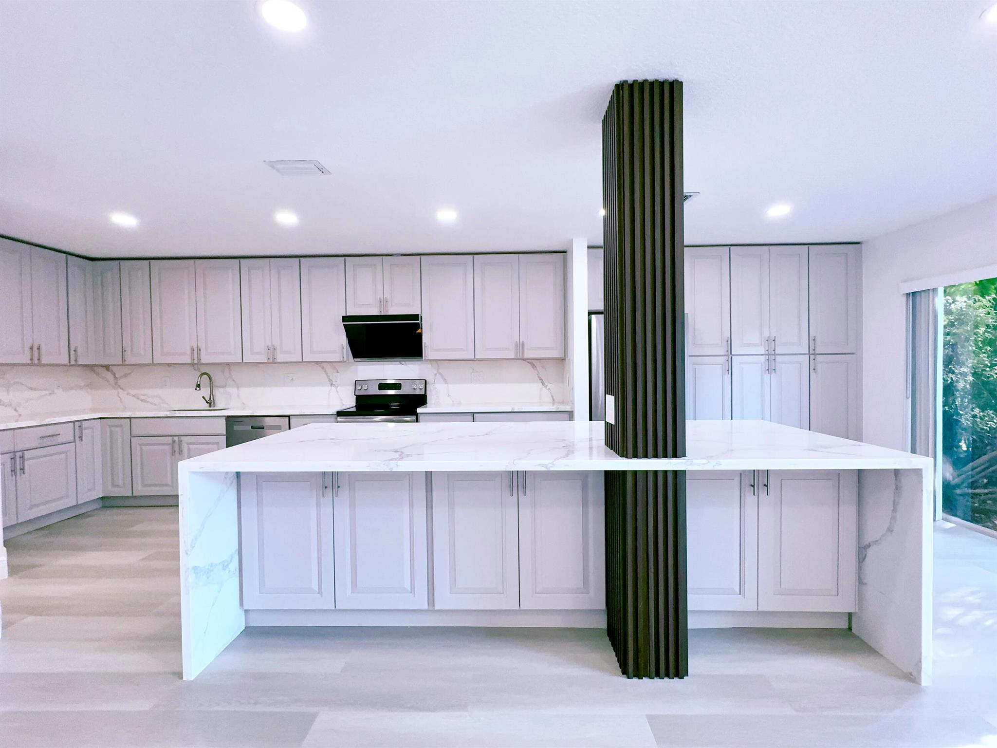 Welcome home to this completely renovated 3/2.5 townhome with a lake view in the heart of Weston. Brand new renovation with luxury tiles in all bathrooms and vinyl flooring in all living area. The oversized kitchen boasts custom high end cabinets, all quartz countertops and backsplash, and largest island in the neighborhood. This a dream house for cooking and entertainment. Custom vent hood and brand new stainless steel appliances. All bathrooms features large walk-in shower with frameless glass doros. Quartz countertops and large frameless rain showers and custom lighting. Brand new paint. Custom LED lighting fixtures and recessed lighting throughout. Brand new water heater. This is a must see! Conveniently located in weston with top-rated schools. Minutes from shopping and dining.
