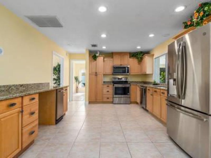 RARE! CBS home, a Waterfront oasis, tucked away on a quiet dead-end street, with private dock and tranquil views on a canal that opens to the Atlantic Ocean. Everything new in 2019! New kitchen w/ stainless appliances & granite counters, A/C, hot water heater, pool heater, pool pump, bathrooms & flooring (Travertine and Ceramic tile). Enjoy fishing and boating from your private 110' dock. Dock has kayak lift and a fish cleaning table. Sprinklers on well. 2 car garage has A/C. Extra parking for a boat trailer or RV. Hurricane shutters. Enjoy the screened in back patio just off the pool with an outside T.V. Just minutes by boat to the Jupiter inlet, restaurants and shopping. Neighborhood boat ramp. Outside furniture negotiable. A short drive to dog beach. No fixed bridges. Measurments approx