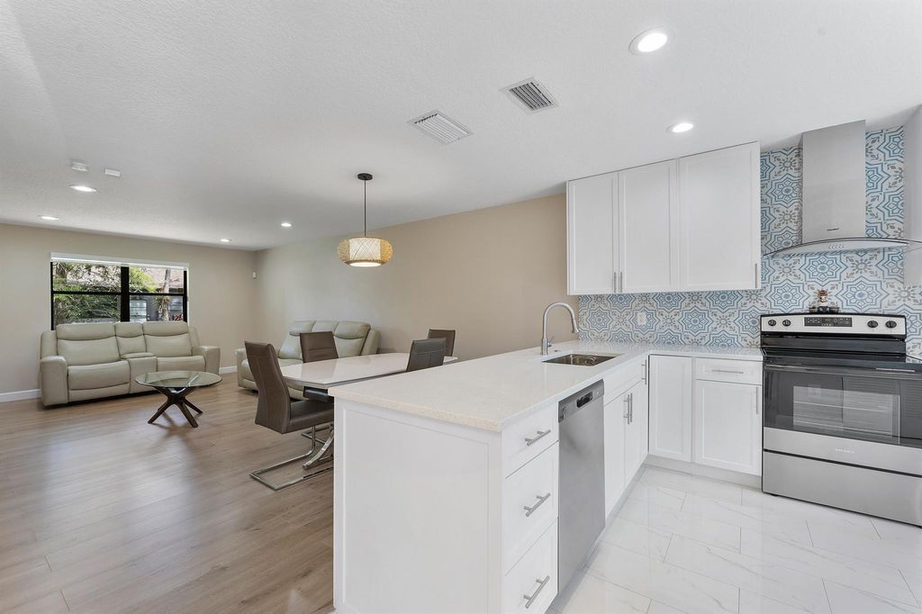 Photo of 319 Elmira Court, Royal Palm Beach, FL 33411 (MLS # R11133367)