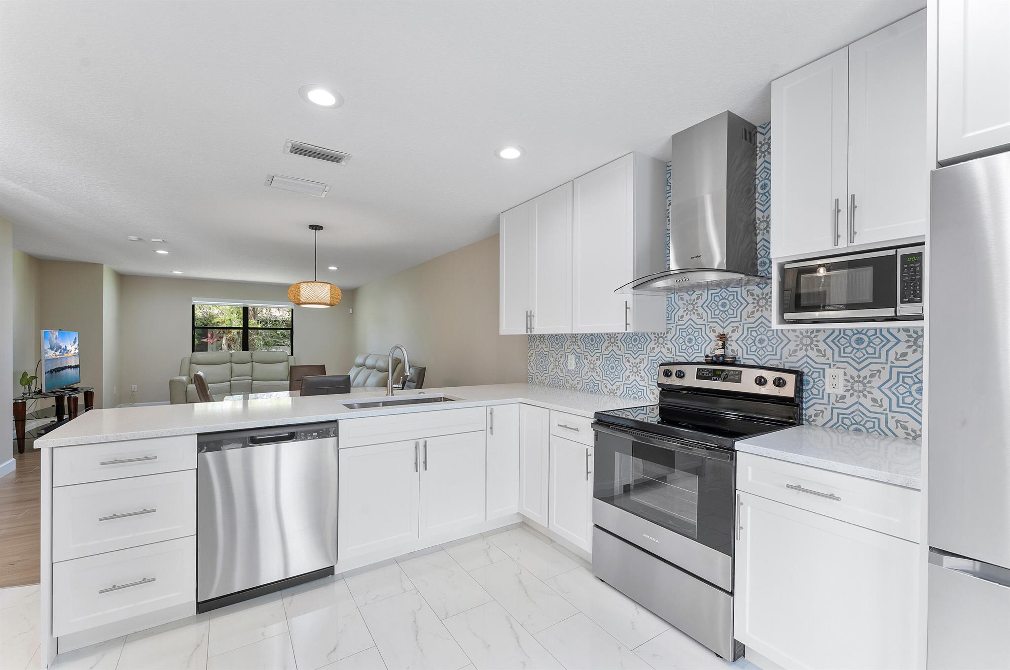 Stunning unit, immaculate, move-in ready!Fully renovated 3-bedroom villa nestled in a peaceful neighborhood, offering the perfect blend of modern style and everyday comfort. The open-concept layout is flooded with natural light and features a brand-new kitchen with quartz countertops, stainless steel appliances, soft-close cabinets, and a spacious island that doubles as a breakfast bar. The elegant dining area is ideal for gatherings. All bedrooms are generously sized with ample closets, and the primary suite includes a walk-in closet with room to create a beautiful ensuite bath. This home is move-in ready. Don't miss the opportunity to own this gem!