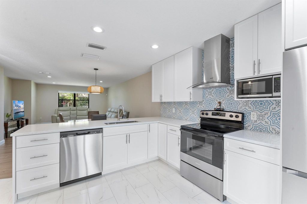 Photo of 319 Elmira Court, Royal Palm Beach, FL 33411 (MLS # R11133367)