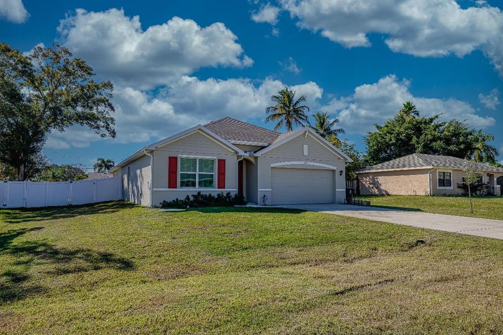 Photo of 2402 SE Gillette Avenue, Port Saint Lucie, FL 34952 (MLS # R11140965)