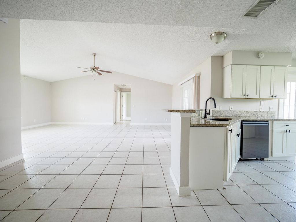 Photo of 3621 SW Rosser Boulevard, Port Saint Lucie, FL 34953 (MLS # B26019277)