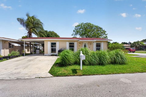 Photo of 1601 NW 48th Place, Deerfield Beach, FL 33064 (MLS # B26030966)