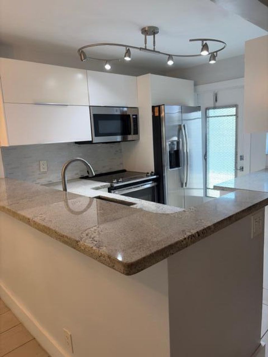 Fully renovated 1 bedroom 1 bath condo for all ages in the heart of Hallandale Beach.  Only a short walk to the beach, shops, Mardi Gras Casino, Gulfstream shops and casino and places of worship. Building is maintained and recently painted light grey.  The complex has a very lush landscaping and a pool which the unit is facing.  Rent includes 1 parking space and water.  Unit has modern kitchen with all stainless steel appliances, ample kitchen cabinets and closet space.  Floors are wide antic white hardwood look tiles throughout.   Call now. a video tour of the unit is available on request and can be sent by whatsapp.