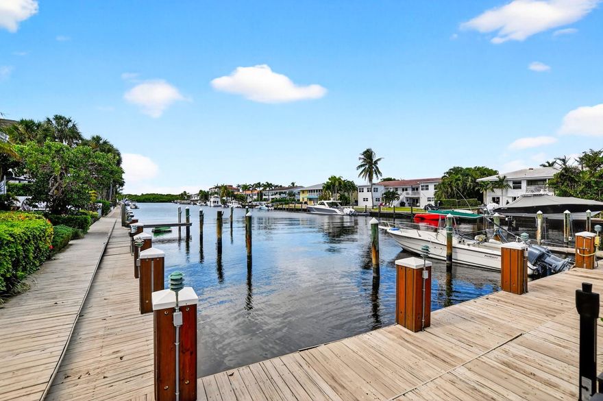 Nestled in the exclusive coastal enclave of Highland Beach, own an impeccably updated townhouse steps from the ocean. Perfectly positioned for boating enthusiasts, with a deeded private dock and ocean access. This light-filled 4-bedroom, 4-bath home (3,084 sq ft) boasts an open-concept living area with soaring ceilings, a gourmet kitchen, a spacious primary suite with a walk-in closet and spa-like bath. Enjoy morning coffee or evening cocktails on your private balcony overlooking the wide canal, with stunning intracoastal views—new impact windows/doors, an oversized 2-car garage, and a private pool, plus walk to the Highland Beach Club. Live the luxurious, low-maintenance Florida lifestyle you’ve always dreamed of—moments to Delray’s vibrant Atlantic Ave and Boca’s fine dining. Stunning!