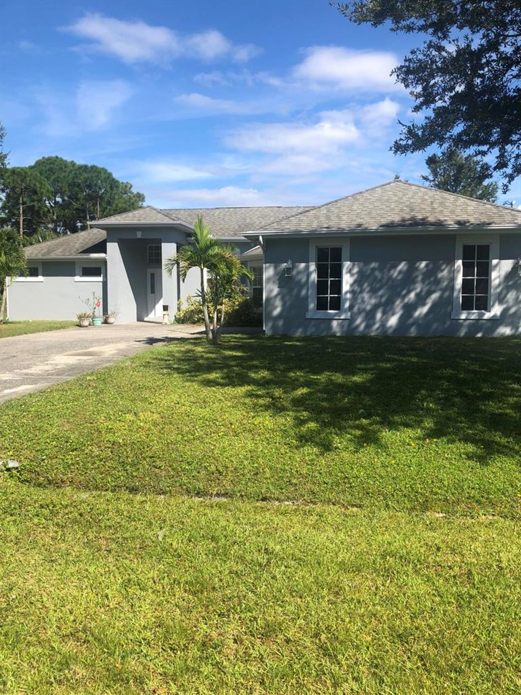Photo of 1481 SW Leisure Lane, Port Saint Lucie, FL 34953 (MLS # R10756125)