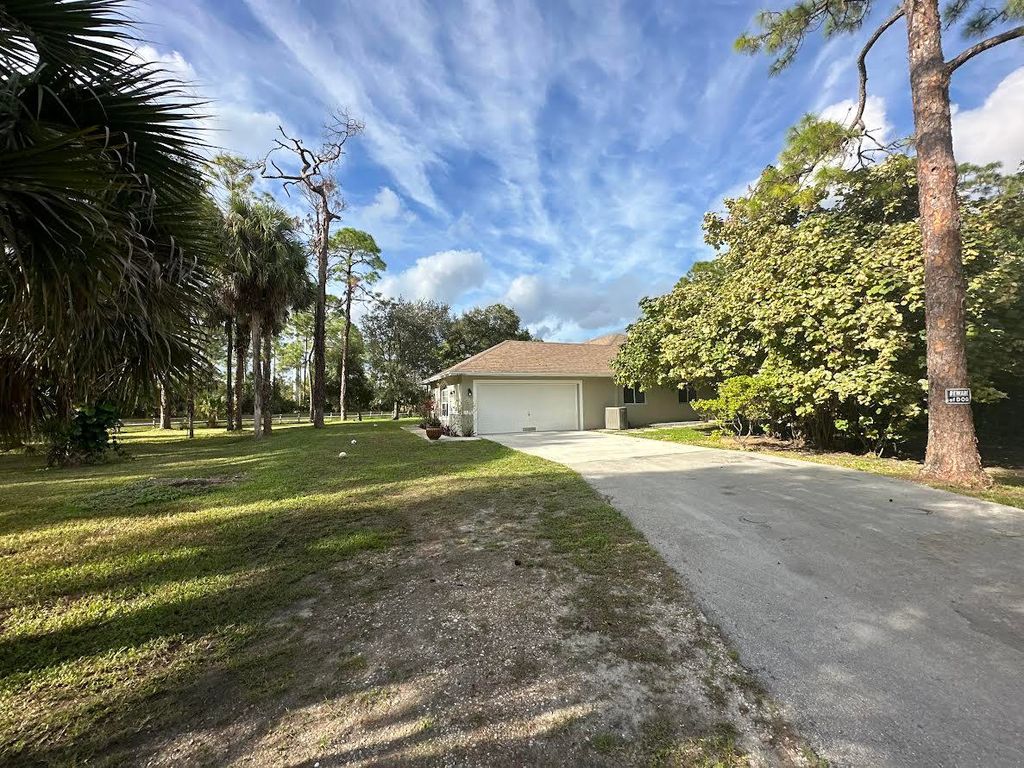 Photo of 15855 99th Court N, West Palm Beach, FL 33412 (MLS # R10938309)