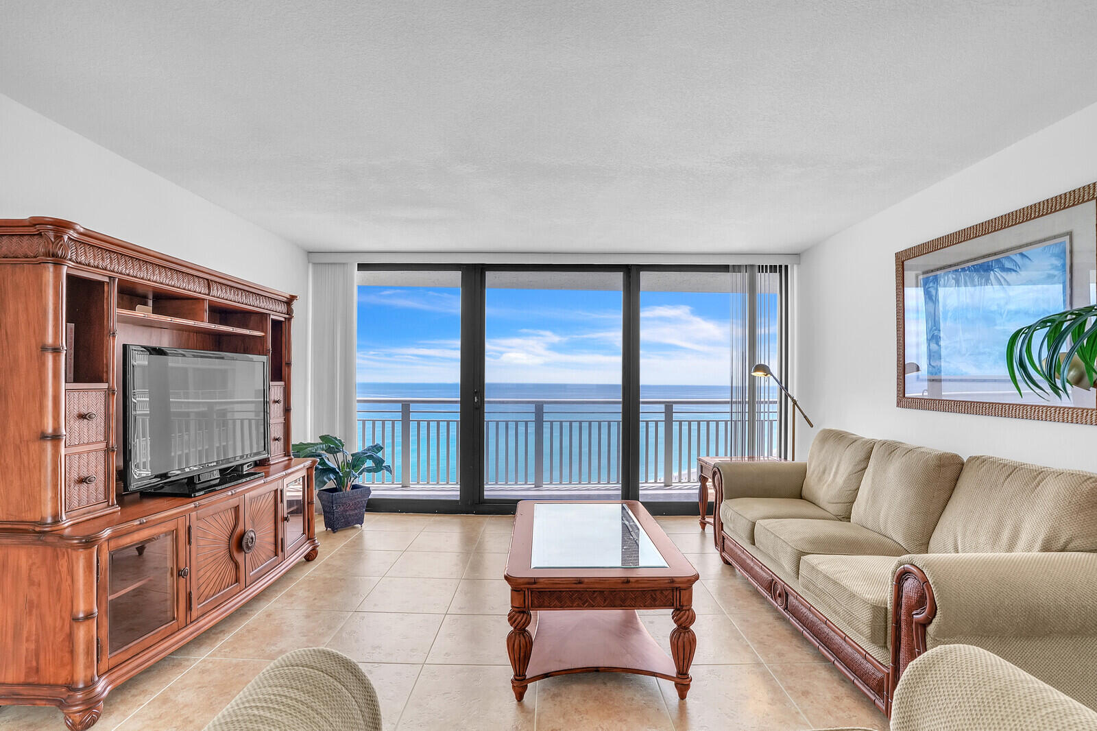 Welcome to Tiara 25C, where every day begins and ends with a view. Perfectly positioned on the 25th floor of one of Singer Island's most sought-after luxury buildings, this spacious condo offers breathtaking panoramas of the Atlantic Ocean to the east and the Intracoastal Waterway to the west -- sunrise to sunset, the scenery is simply unforgettable.Step inside to a light-filled, well-maintained residence with floor-to-ceiling glass that captures the endless water views. The private balcony is your front-row seat to morning coffee with the ocean breeze and evening cocktails with glowing sunsets.