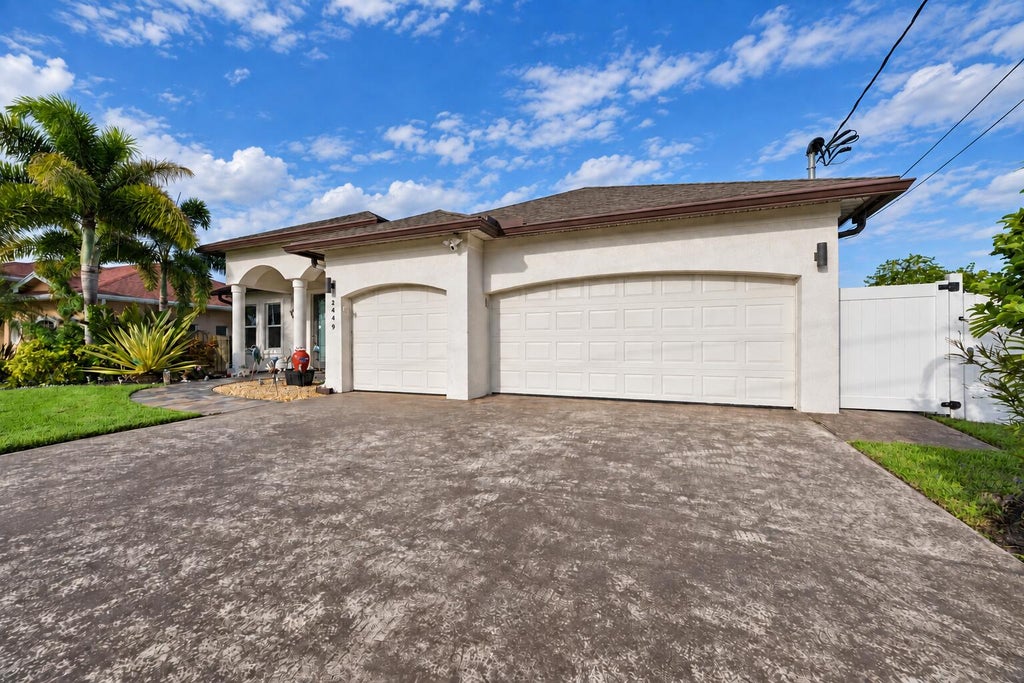 Photo of 2449 SW Gay Circle, Port Saint Lucie, FL 34953 (MLS # B26073217)