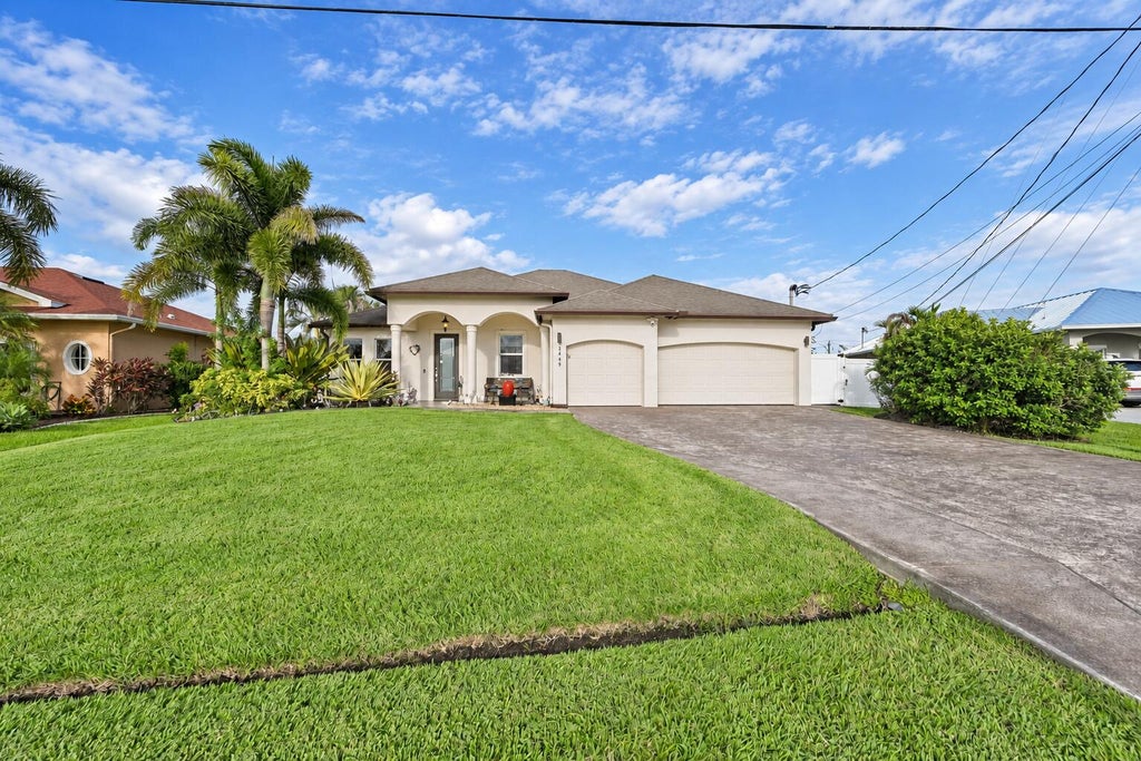 Photo of 2449 SW Gay Circle, Port Saint Lucie, FL 34953 (MLS # B26073217)