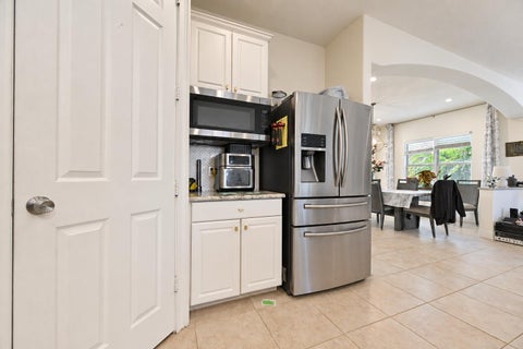 Photo of 2449 SW Gay Circle, Port Saint Lucie, FL 34953 (MLS # B26073217)
