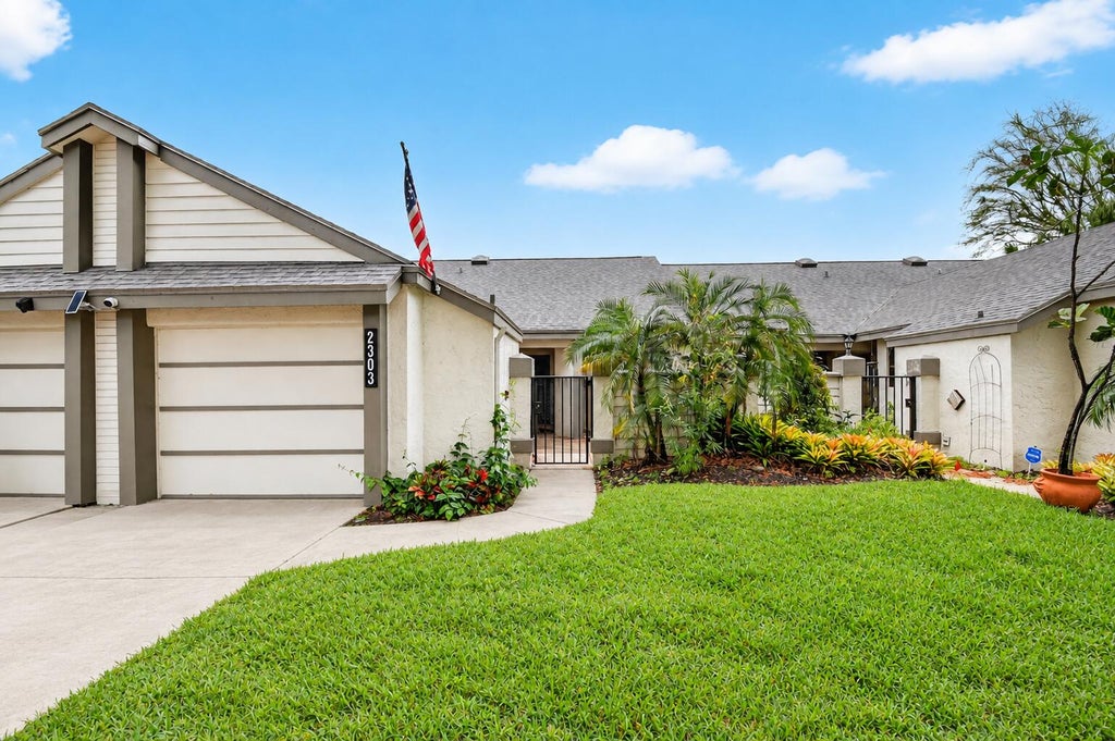 Photo of 2303 Landings Boulevard, Greenacres, FL 33413 (MLS # B26082762)