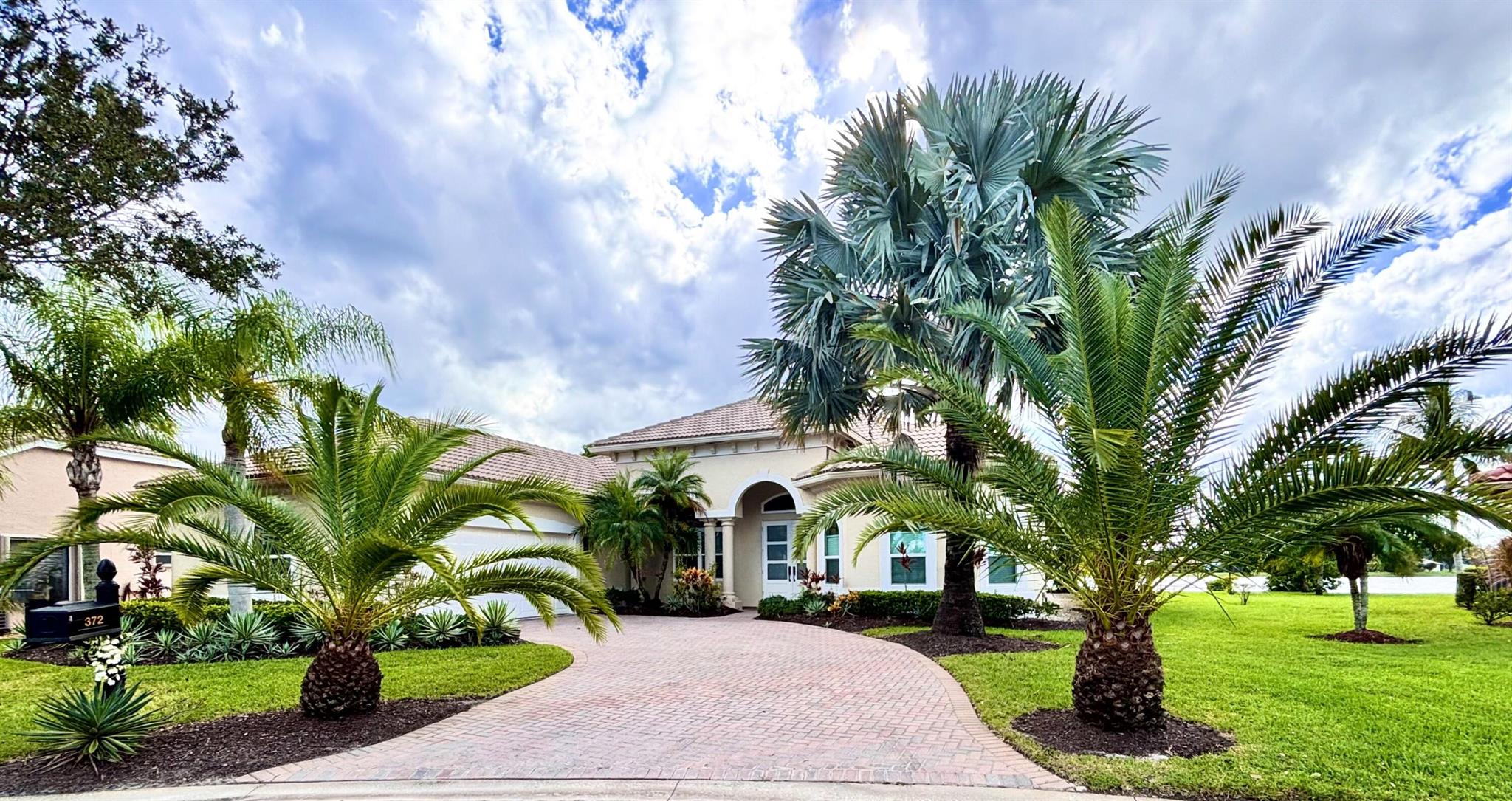 EXQUISITE 4-Bed/3-Bath + DEN Estate POOL HOME with Panoramic LAKE VIEWS and Breathtaking Sunsets. Experience RESORT-STYLE LIVING in this stunning, fully updated home that perfectly blends modern elegance with comfort. Step through the GRAND ENTRANCE into a space defined by SOARING CEILINGS, 8-FOOT DOORS, and freshly TILED FLOORS throughout. Your PRIVATE BACKYARD OASIS awaits--lush tropical landscaping, multiple gathering areas, an outdoor dining space, BUILT-IN GRILL and BAR, and a HEATED SALTWATER POOL--all overlooking the serene beauty of the lake. Inside, the GOURMET CHEF'S KITCHEN impresses with QUARTZ countertops, a professional-grade VIKING GAS RANGE, a butler's pantry, and a BEVERAGE FRIDGE. The SPA-INSPIRIED primary suite features a luxurious bathroom; SOAKING TUB, RAIN SHOWER...