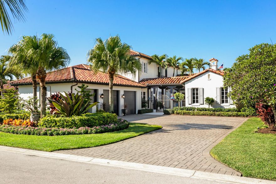 This stunning transitional coastal estate offers gorgeous golf course views, a tranquil west sunset exposure with comfortable elegance and impeccable upgrades and finishes throughout.  The moment you walk through the private gated entry leading into the newly remodeled courtyard featuring stone flooring accented by river stone plant beds and accent lighting, you will feel the warmth and luxury of this home.  The gourmet kitchen is inviting with light cabinetry and a large center island and all upgraded appliances.  The long extended family room offers beautiful views of the gorgeous tropical pool and patio area.  The formal living area with French doors leads out to the patio and serves as a wonderful place for entertaining guests.  The stately master bedroom has also been extended and offers French Doors out onto the patio as well.  No stone left unturned in this immaculately cared for home.  Gorgeous landscape lighting creates a truly one of a kind oasis with over 30 palm trees amidst the professionally landscaped/night/light scaped.  This tropical oasis is within Trump National.  Minutes from the Atlantic ocean, PBI Airport, Kravis Center, Abacoa Amphitheater, not for profit nationally ranked Jupiter Medical Center and Triple A rated schools.