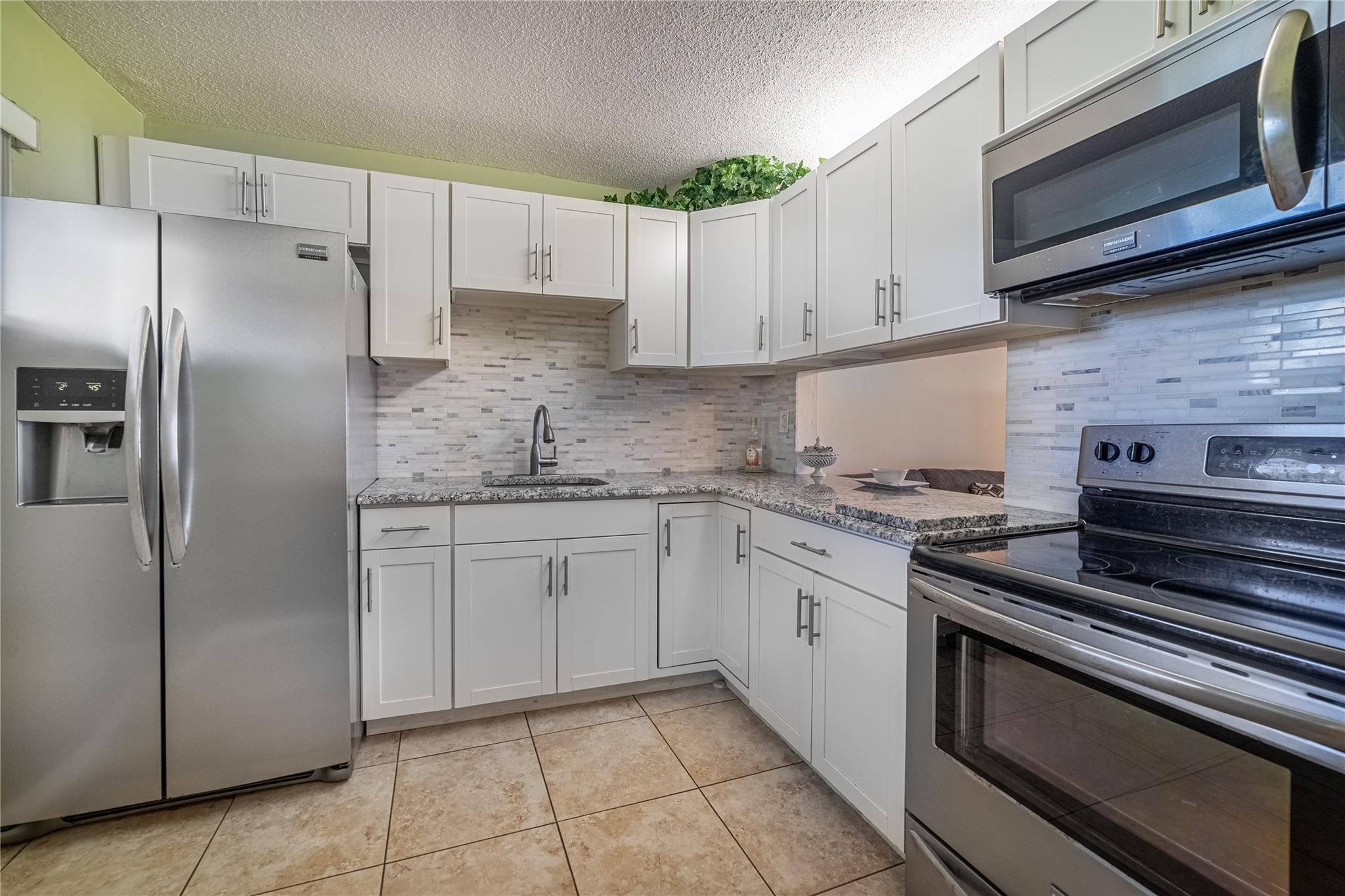 This spacious top-floor 2-bedroom, 2-bath condo with recently Updated Kitchen and Bathroom in a peaceful 55+ community offers quiet, comfortable living in a well-maintained building with elevator access. The HOA fee is only $782 for this unit. The unit features new Water Heater, and Hurricane rolling shutters throughout. Located on the third floor, Unit 310 boasts plenty of natural light, generous closet space, and a functional layout ideal for both full-time or seasonal residents.