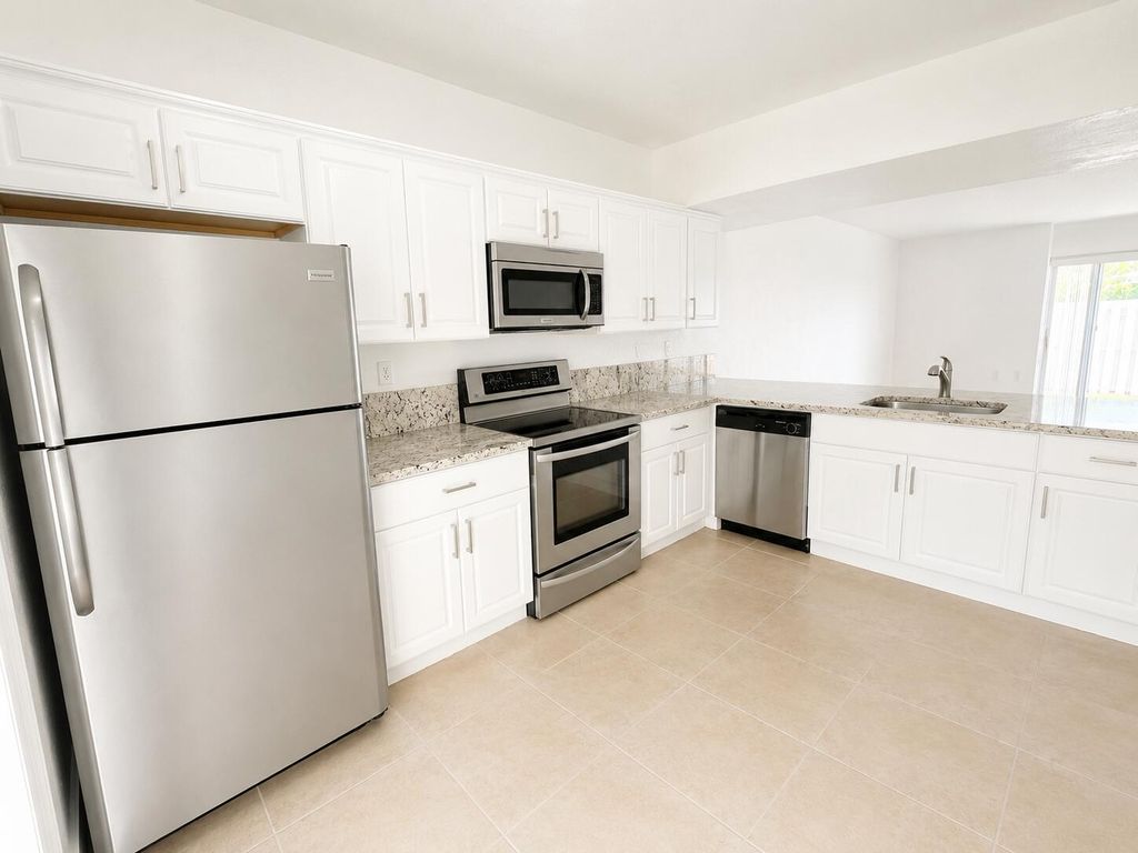 Photo of 887 Crystal Lake Drive, Pompano Beach, FL 33064 (MLS # B26034547)