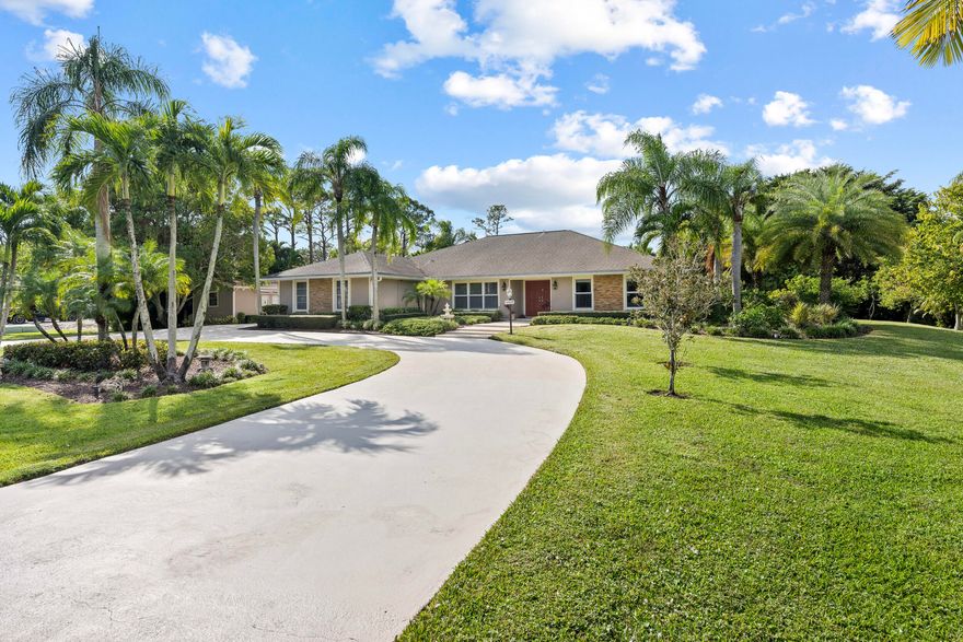 Set on 1.15 acres in Palm Beach Country Estates, this beautifully upgraded 4BR/3BA home offers privacy, space, and modern efficiency with no HOA. Notable features include a whole-house generator, solar panels providing low to minimal electric bills, a 250-gallon in-ground propane tank, and an instant propane hot water heater for energy-efficient living.

The chef's kitchen is equipped with double ovens, a - 6 burner gas cooktop, and a built-in steam oven, ideal for both everyday cooking and entertaining. Designed with gatherings in mind, the property features a screened pool with removable child safety fencing, a full outdoor kitchen, and an expansive driveway with ample space for multiple cars, trucks, boats, and recreational vehicles. A separate detached studio/workshop offers exceptional flexibility perfect for an artist's studio, home office, gym, or hobby space. Situated on a quiet street in a prime Jupiter location, this property delivers acreage, upgrades, and lifestyle convenience rarely found together.