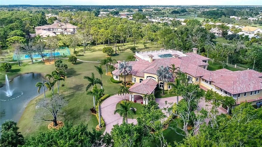 AUCTION: Bid August 22–27 | Previously $6.975M | No Reserve | Open Daily 1–4PM & by ApptA meticulously landscaped 6.55 acres with private pond, tennis court, & park-like landscaping, and an expansive 17,791sf Mediterranean-style, you’ll know that 21573 El Bosque Way is the paradise you’ve been longing for. A entertainer’s dream, this two-story haven boasts a home theater, fitness center, & billiards room, plus a guest & additional caretakers quarters. Screened-in 2,500sf atrium with a saltwater pool, jacuzzi, lounge areas, skylight, & folding glass door access. Stables, 6 balconies, 2,000sf sun deck, 8-car garage, porte-cochere & nonstop luxuries. Live a life of unparalleled bliss at 21573 El Bosque Way.