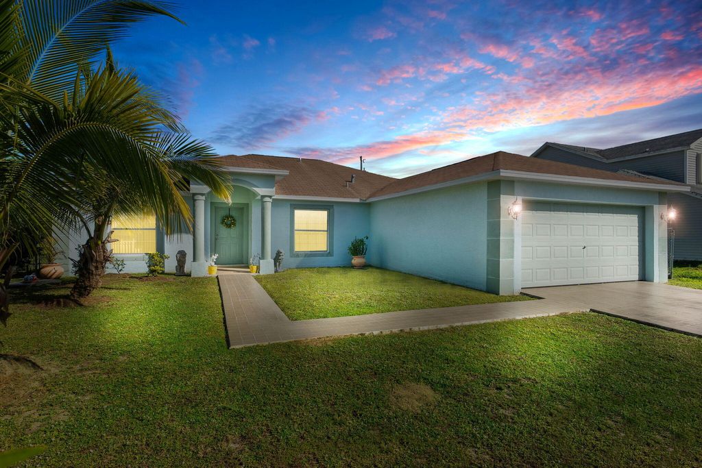 Photo of 4149 SW Tuscol Street, Port Saint Lucie, FL 34953 (MLS # R10854619)