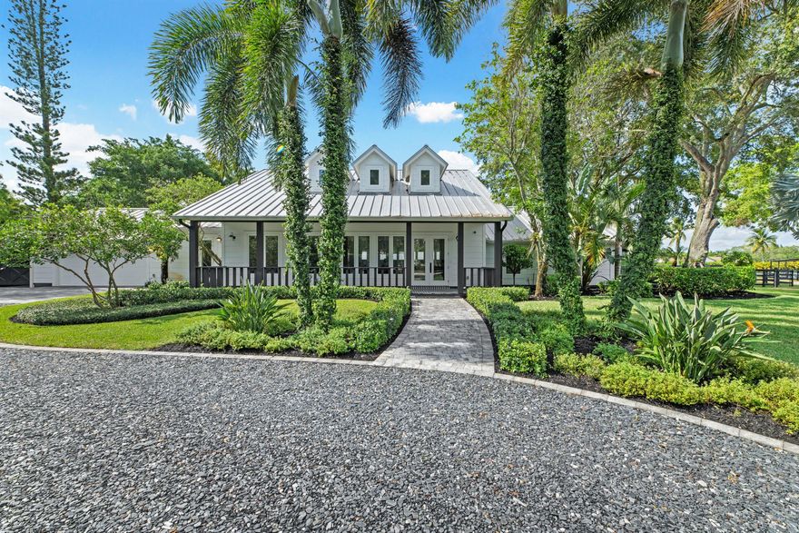 Welcome to your dream equestrian oasis in the heart of Saddle Trail! Spanning an impressive 4.75 acres and offering unparalleled convenience with a short hack to the renowned Wellington International (WEF). Immerse yourself in the equestrian lifestyle with this meticulously renovated 4-bedroom, 4.5-bath home, with an office/den and breathtaking views of the property. As you step inside, you'll be captivated by the light and open floor plan. The home was fully renovated in 2020 and designed for both comfort and entertainment. Featuring a split floor plan, there are a total of four bedrooms, each with its own en-suite bathroom. The master suite wing is a true retreat, featuring his and hers water closets and walk-in closets, an oversized dual shower, luxurious soaking tub, and a private laundry area. All windows and doors have been upgraded to impact glass, and the mud room was upgraded with a dog wash station. The heart of the home lies in the custom chef's kitchen, complete with Thermador appliances and ample counter space. Flowing seamlessly into the dining and entertaining areas, this space is perfect for hosting gatherings or enjoying intimate meals. Discover the hidden butler's pantry/bar, adding an extra touch of luxury and convenience. No detail has been overlooked in this home, which is equipped with RTI-controlled systems, including a 16-color video security system. You'll find two barns with plentiful airflow on the property, totaling 14 stalls, providing ample space for your beloved horses. Storage areas ensure that all your equipment is neatly organized, while the air-conditioned tack room features a laundry and half bath for added convenience. Equestrians will appreciate the new expansive all weather ESI arena with  textile footing, measuring approximately 160 x 230. Additional amenities include a covered viewing area with speakers and power, a covered MK 6 horse walker, and plenty of space for trailer parking. Separate buildings dedicated to storage add to the functionality and efficiency of this exceptional property. There's ample space available to build more stalls or an additional barn. Don't miss out on this truly one-of-a-kind property. Immerse yourself in the equestrian lifestyle, surrounded by top-notch facilities and unparalleled convenience. Schedule your private viewing today and experience the pinnacle of equestrian living.