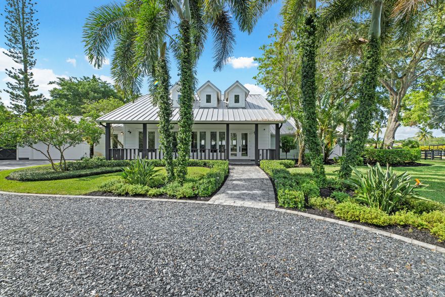 Welcome to your dream equestrian oasis in the heart of Saddle Trail! Spanning an impressive 4.75 acres and offering unparalleled convenience with a short hack to the renowned Wellington International (WEF). Immerse yourself in the equestrian lifestyle with this meticulously renovated 4-bedroom, 4.5-bath home, with an office/den and breathtaking views of the property. As you step inside, you'll be captivated by the light and open floor plan. The home was fully renovated in 2020 and designed for both comfort and entertainment. Featuring a split floor plan, there are a total of four bedrooms, each with its own en-suite bathroom. The master suite wing is a true retreat, featuring his and hers water closets and walk-in closets, an oversized dual shower, luxurious soaking tub, and a private laundry area. All windows and doors have been upgraded to impact glass, and the mud room was upgraded with a dog wash station. The heart of the home lies in the custom chef's kitchen, complete with Thermador appliances and ample counter space. Flowing seamlessly into the dining and entertaining areas, this space is perfect for hosting gatherings or enjoying intimate meals. Discover the hidden butler's pantry/bar, adding an extra touch of luxury and convenience. No detail has been overlooked in this home, which is equipped with RTI-controlled systems, including a 16-color video security system. You'll find two barns with plentiful airflow on the property, totaling 14 stalls, providing ample space for your beloved horses. Storage areas ensure that all your equipment is neatly organized, while the air-conditioned tack room features a laundry and half bath for added convenience. Equestrians will appreciate the new expansive all weather ESI arena with  textile footing, measuring approximately 160 x 230. Additional amenities include a covered viewing area with speakers and power, a covered MK 6 horse walker, and plenty of space for trailer parking. Separate buildings dedicated to storage add to the functionality and efficiency of this exceptional property. There's ample space available to build more stalls or an additional barn. Don't miss out on this truly one-of-a-kind property. Immerse yourself in the equestrian lifestyle, surrounded by top-notch facilities and unparalleled convenience. Schedule your private viewing today and experience the pinnacle of equestrian living.