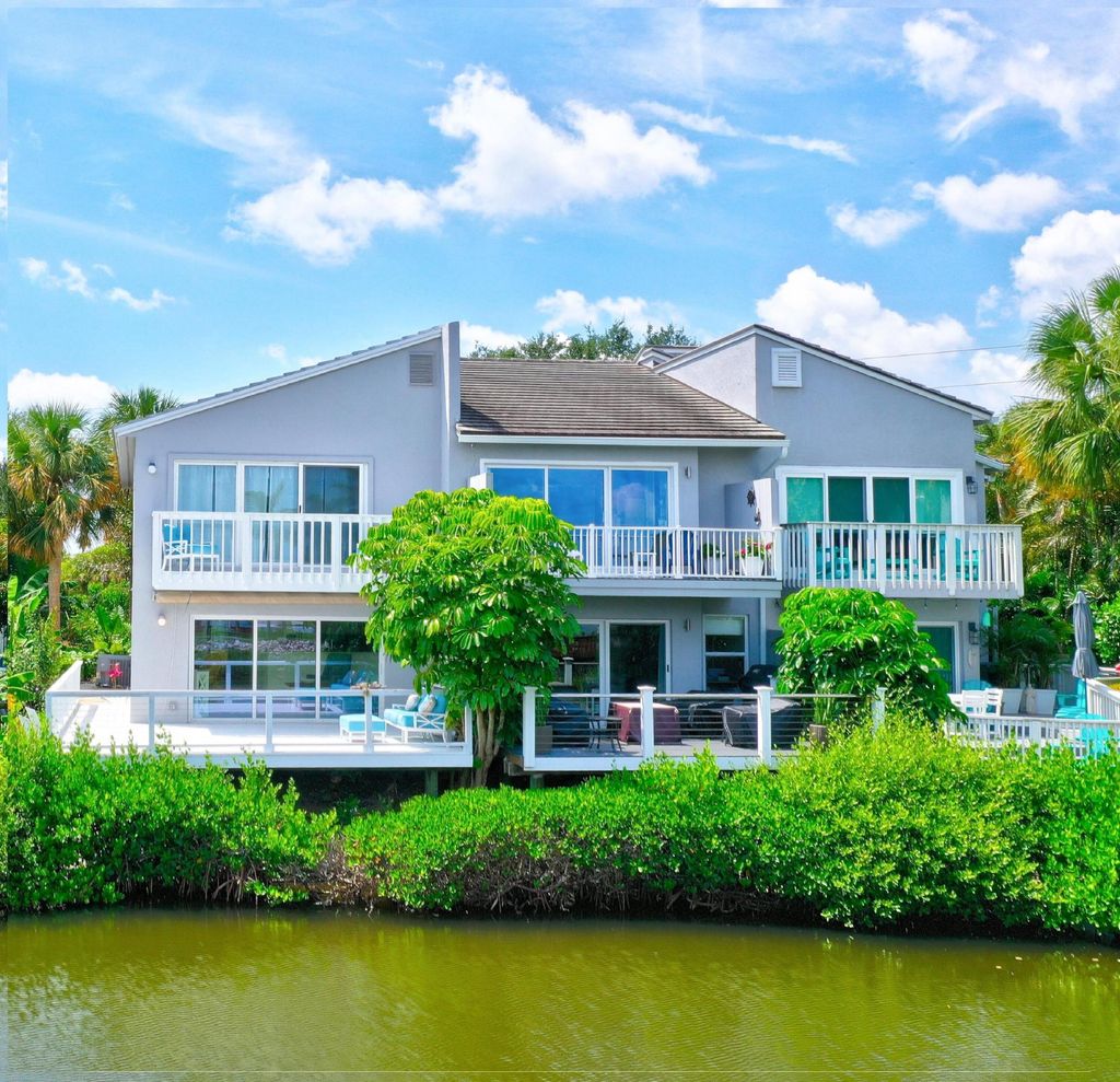 Photo of 2460 Harbour Cove Drive, Hutchinson Island, FL 34949 (MLS # R10946102)