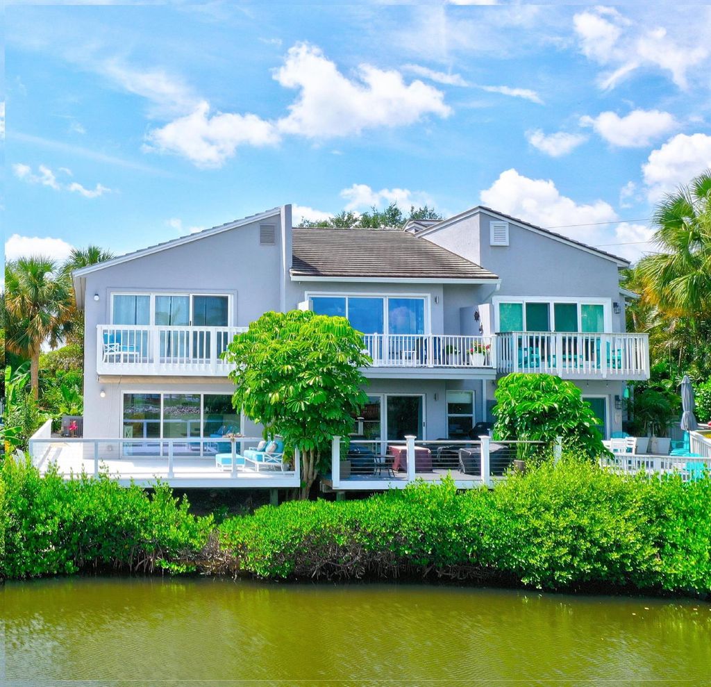 Photo of 2460 Harbour Cove Drive, Hutchinson Island, FL 34949 (MLS # R10946102)