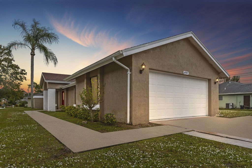 Photo of 6907 NW Hershy Circle, Port Saint Lucie, FL 34983 (MLS # R10942930)