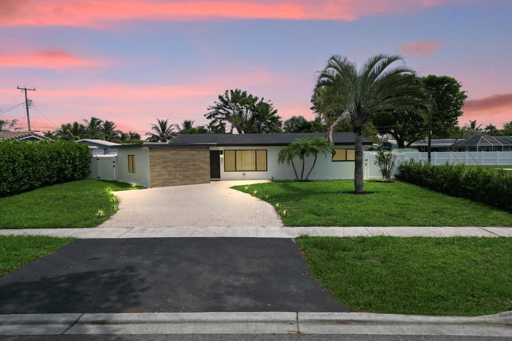 Coastal Beauty! No expense was spared on this completely remodeled 4-Bedroom 3-Bath home in the Cove area of Deerfield Beach. Impact windows, tiles flooring throughout, modern kitchen with all the bells and whistles. Split floorplan for ultimate privacy. Offered fully furnished and tastefully appointed or unfurnished if needed. Spacious yard with deck to enjoy the sunshine or entertain your friends and family. Bike to restaurants, beaches, and all Deerfield Beach has to offer.
