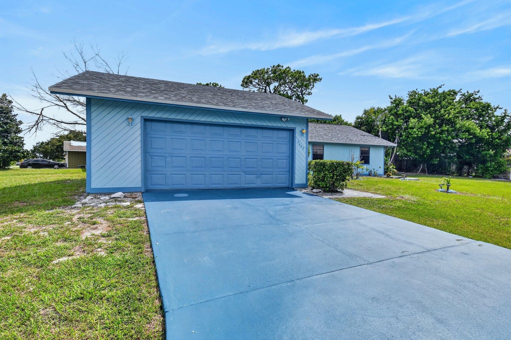 Photo of 2402 SW SUMMIT Street, Port Saint Lucie, FL 34984 (MLS # B26062347)