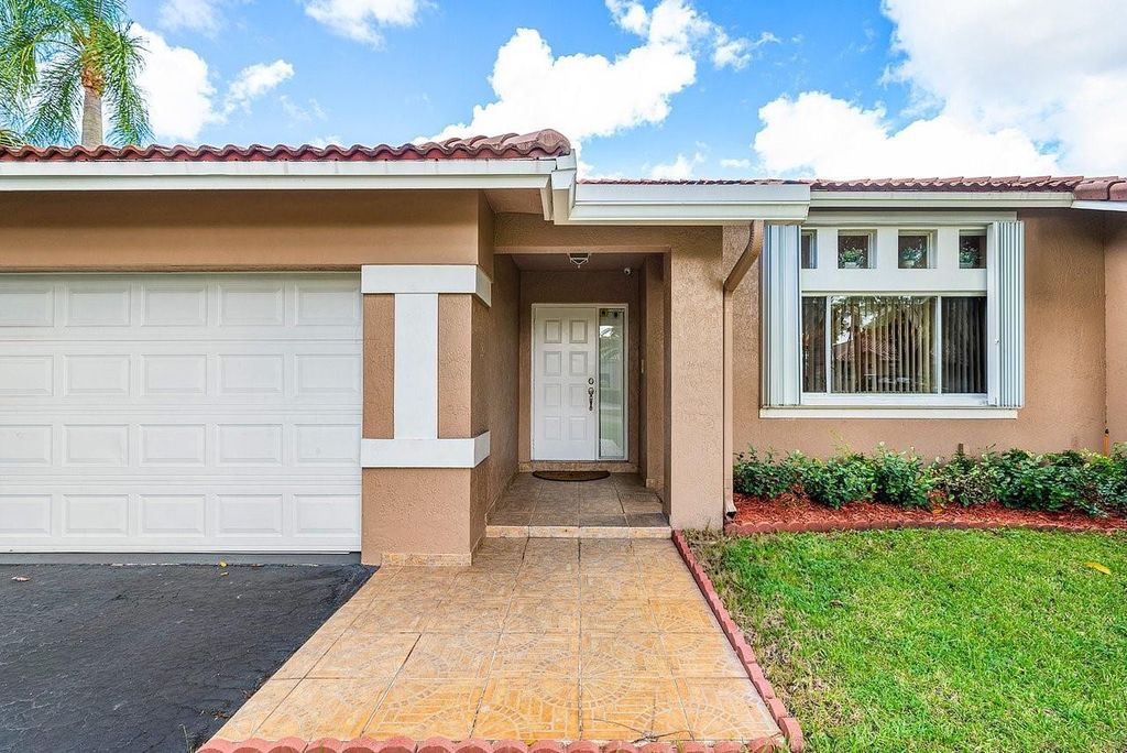 Photo of 9861 NW 28th Place, Coral Springs, FL 33065 (MLS # F10534386)