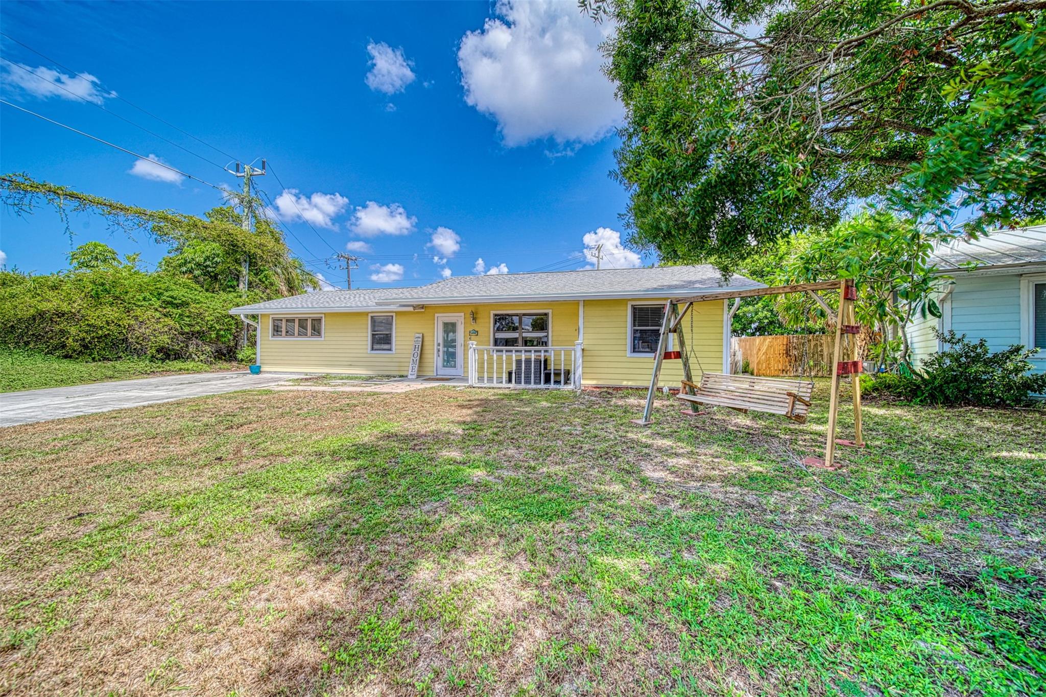 Affordable 3/2 in Jensen Beach. New roof! Hardie board siding, split plan, cathedral ceiling, open floor plan, large air-conditioned laundry room. Two sheds for storage and side driveway with gate for boat, trailer, or RV parking. Huge back yard! Walking distance to Jensen Beach Elementary and short ride to downtown Jensen, River, Boat Ramps, Beaches, and more.
