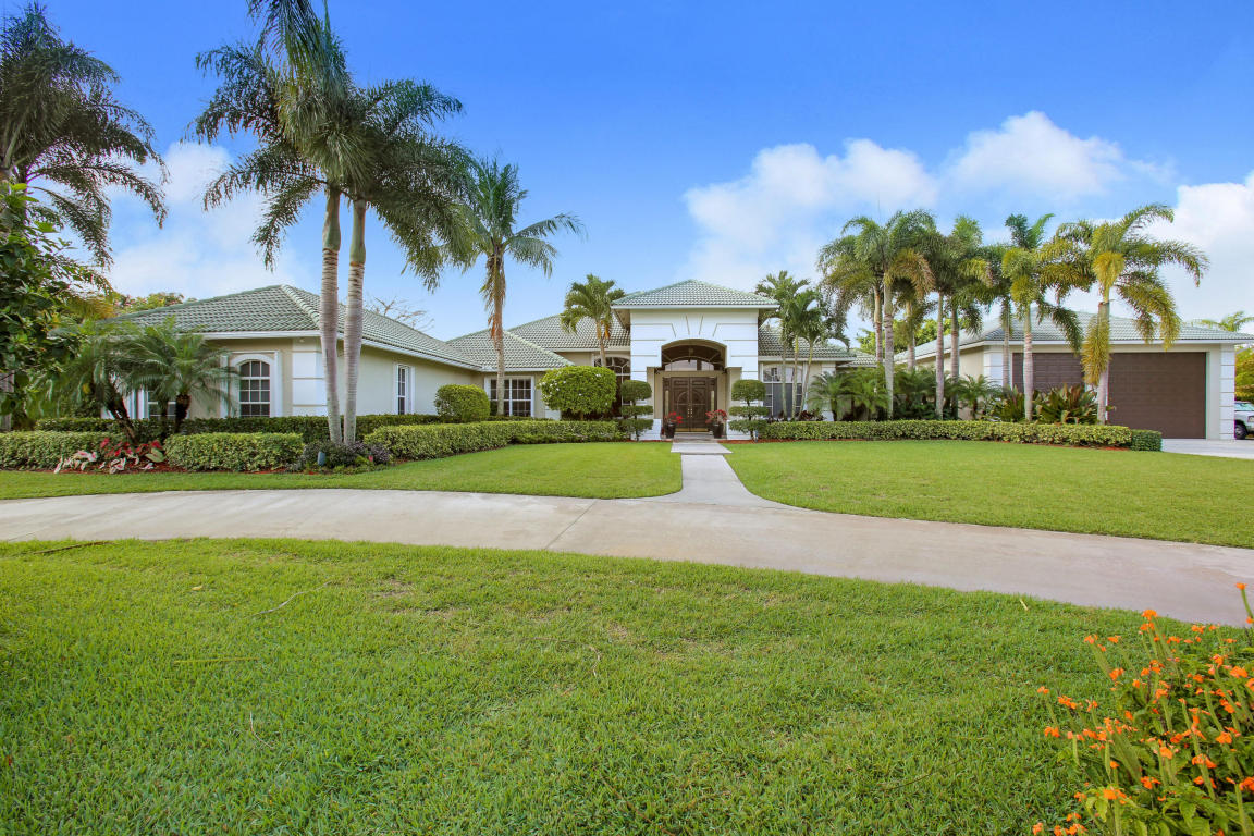 2.33 acres Featuring 5 stall barn w/office, 100X200 riding arena, 4 paddocks, 3 car garage plus detached 40X60 garage w/ service doors that are 14FTX16FT & 14FTX12FT,PLUS huge walk in closet with storage above. Full house generator for main house & barn (not gym or back office) Entire home has either Impact,accordion or electric roll down shutters for all windows.The home has a Savant home automation system (SMART HOME)that stays with the property and also a Jandy system that runs the landscape lighting & pool/fountain. The office has built in king size Murphy bed & custom built in.The gym area can easily be converted to a media or game room.There are endless options. Heated pool W/ gas lamps around pool & patio,Custom built outdoor kitchen & covered patio, crown molding
