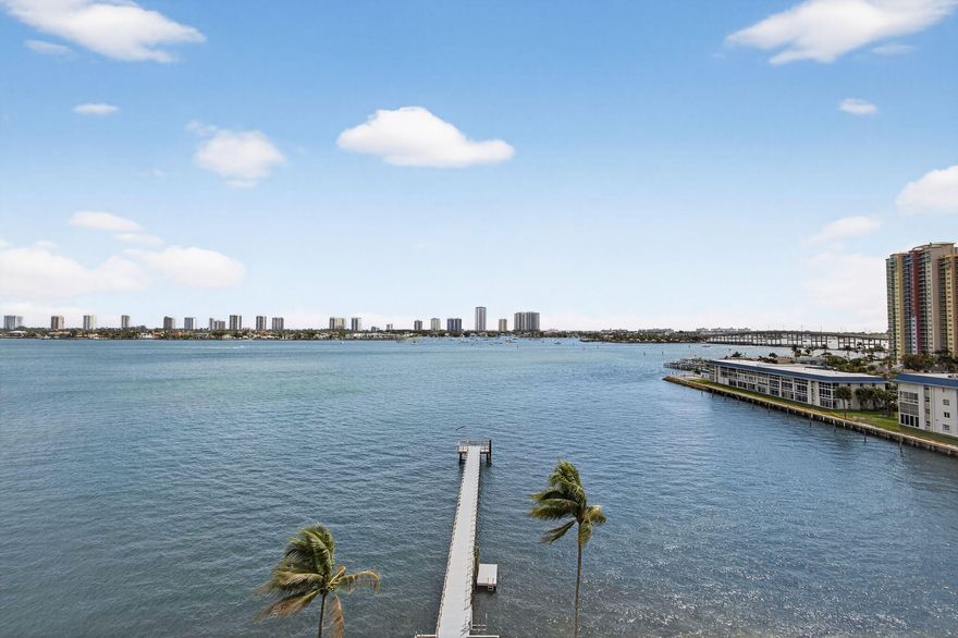 Enjoy spectacular sunrises and sweeping Intracoastal and ocean views from every room in this updated 2-bedroom, 2-bath waterfront condo, ideally located in a rapidly developing area. The split floor plan features a spacious primary suite with a large walk-in closet and renovated en-suite bath with oversized walk-in shower. A versatile second bedroom is perfect for guests or a home office. The modern kitchen offers stainless steel appliances and granite countertops, opening to bright living spaces framed by impact glass. Relax on your private balcony and take in the views. Includes in-unit washer/dryer and is just minutes to beaches, boating, golf, shopping, dining, and the airport.