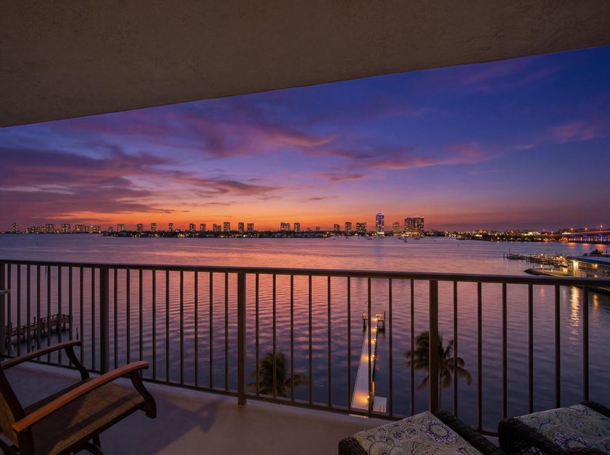 Enjoy spectacular sunrises and sweeping Intracoastal and ocean views from every room in this updated 2-bedroom, 2-bath waterfront condo, ideally located in a rapidly developing area. The split floor plan features a spacious primary suite with a large walk-in closet and renovated en-suite bath with oversized walk-in shower. A versatile second bedroom is perfect for guests or a home office. The modern kitchen offers stainless steel appliances and granite countertops, opening to bright living spaces framed by impact glass. Relax on your private balcony and take in the views. Includes in-unit washer/dryer and is just minutes to beaches, boating, golf, shopping, dining, and the airport.
