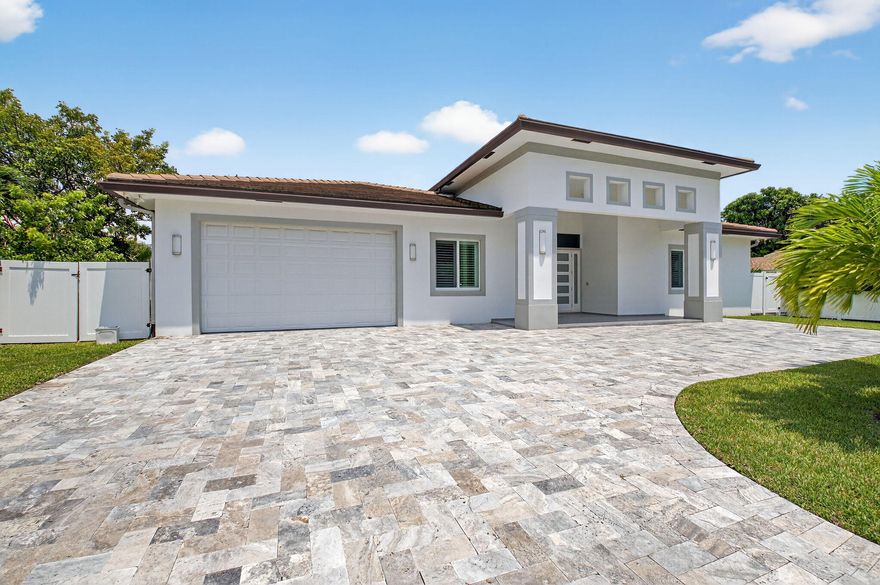 Welcome to your dream coastal living style — walking distance to Boca Raton's pristine beaches and exclusive Red Reef Golf Course. This stunning modern single-family home showcases an open-concept design with clean lines, soaring ceilings, and abundant natural light. Featuring 5 spacious bedrooms, with ensuite bathroom, residence provides exceptional privacy and comfort for family and guests. The chef's kitchen and expansive living areas flow seamlessly to the outdoors, salt water heated lap pool, summer kitchen, and covered patio, perfect for entertaining, or simply relaxing in style. This home embodies the ultimate blend of luxury and convenience, offering a resort-like lifestyle in one of Boca Raton Riviera most desirable locations. 5+ Parking Space.