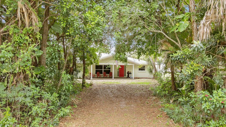 Experience the ultimate in peace and privacy with this beautifully situated 1.14 acre estate. This solid CBS-constructed home offers 3 spacious bedrooms and  2 full bathrooms, as well as a fully fenced in yard, providing the perfect canvas for your Florida lifestyle. The home features a functional split floor plan and ample natural light. Step outside to a massive backyard and large 20' x 30' steel out-building ready for your personal touch, perfect for outdoor entertaining or expanding your living space. A recent full roof and A/C replacement means less worries and more peace of mind. Enjoy the freedom of no HOA restrictions while still being close to West Palm Beach amenities.  Schedule your private showing today and discover the charm of rural living with city convenience.