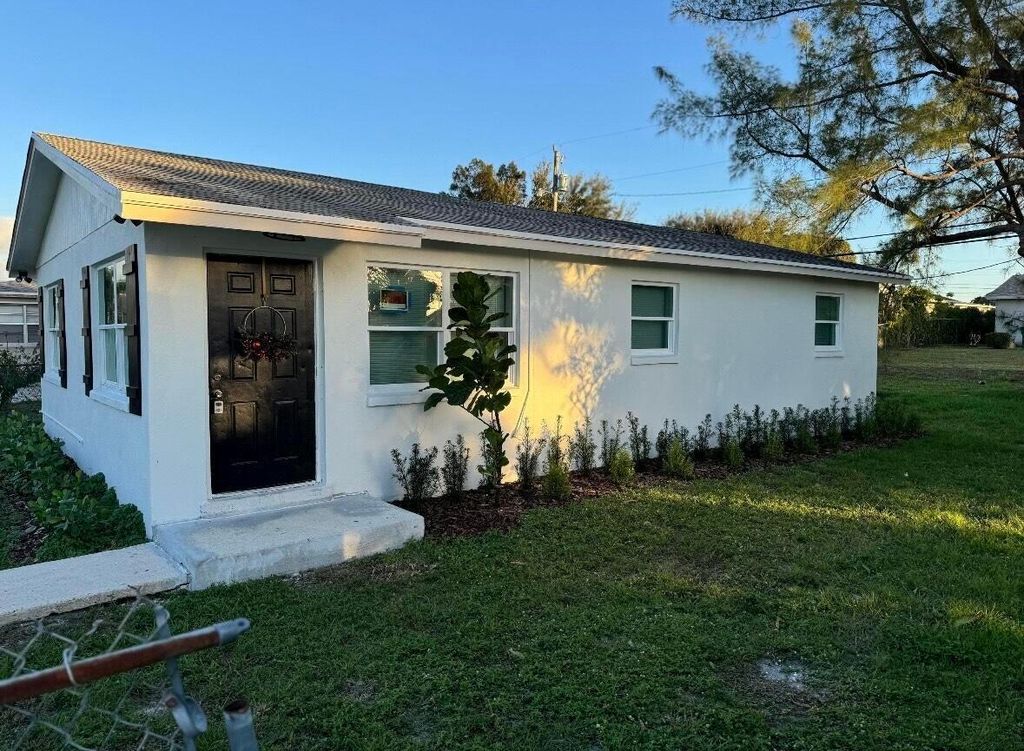 Photo of 1341 W 32nd Street, Riviera Beach, FL 33404 (MLS # R11134895)