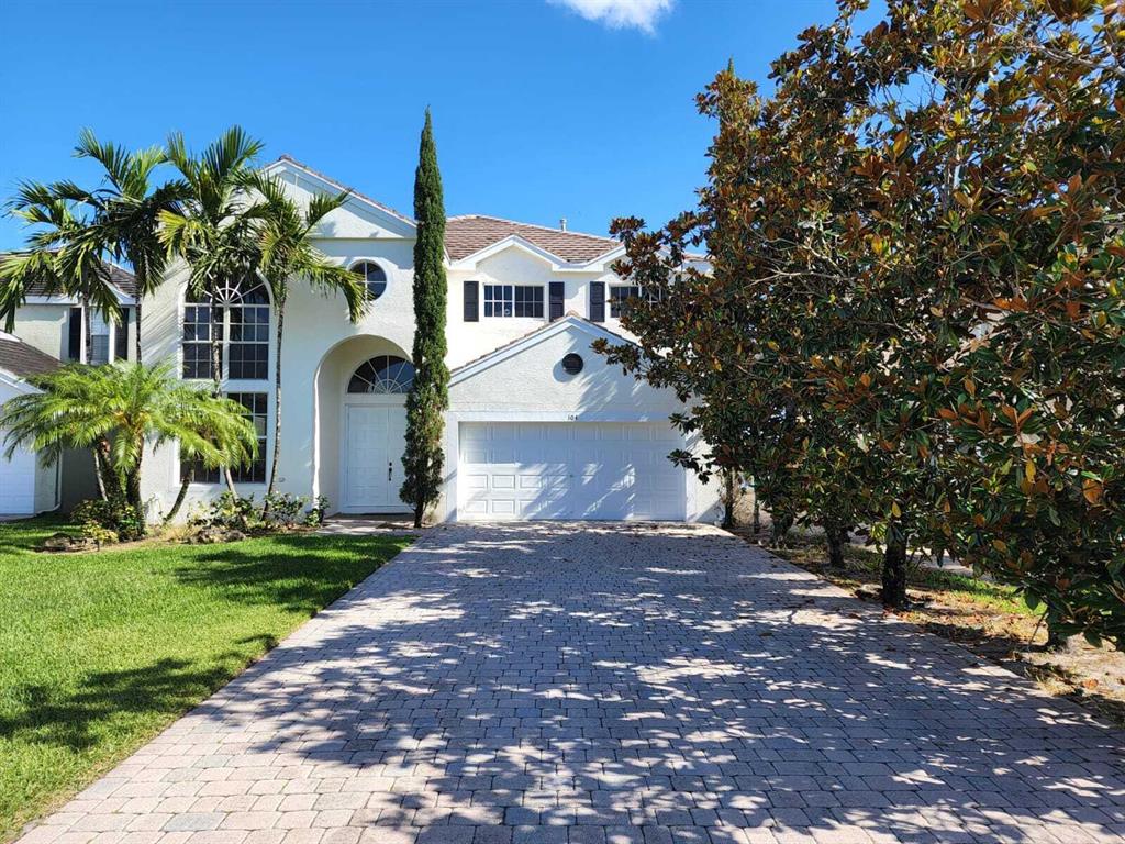 Photo of 104 Churchill Circle Cir, Royal Palm Beach, FL 33414 (MLS # R10795069)