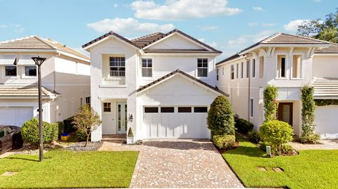 Photo of 125 Bonnette Hunt Club Lane, Palm Beach Gardens, FL 33418 (MLS # B26039718)