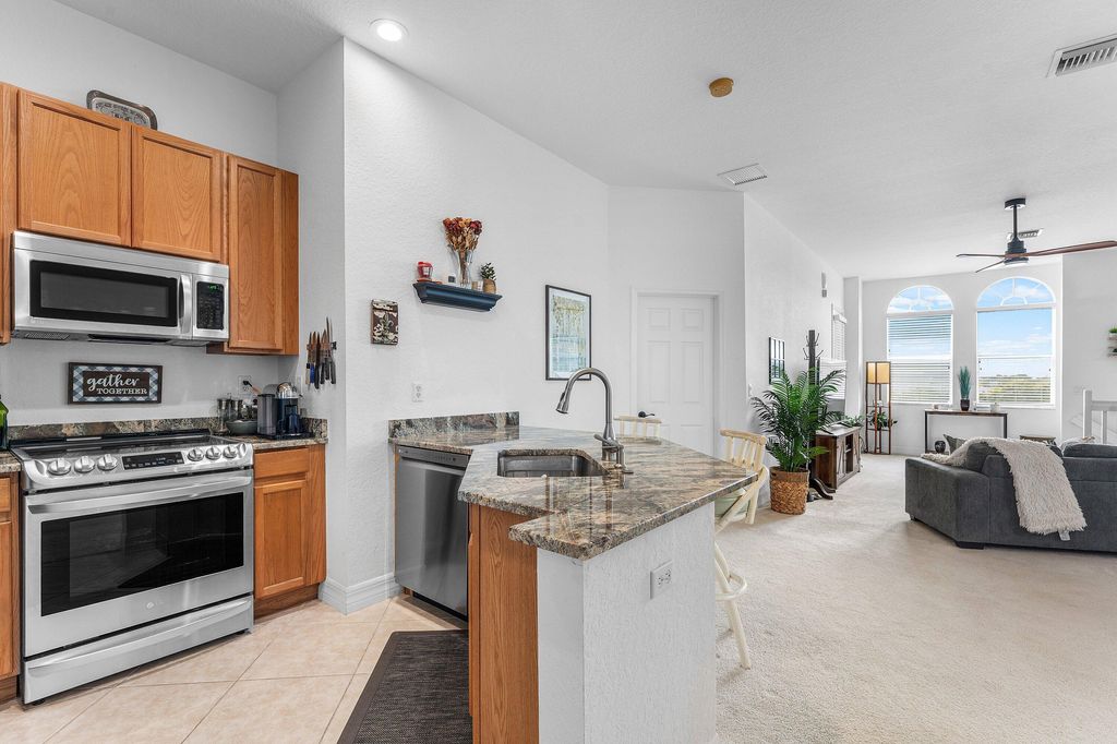 Photo of 4931 Bonsai Circle #201, Palm Beach Gardens, FL 33418 (MLS # B26000241)