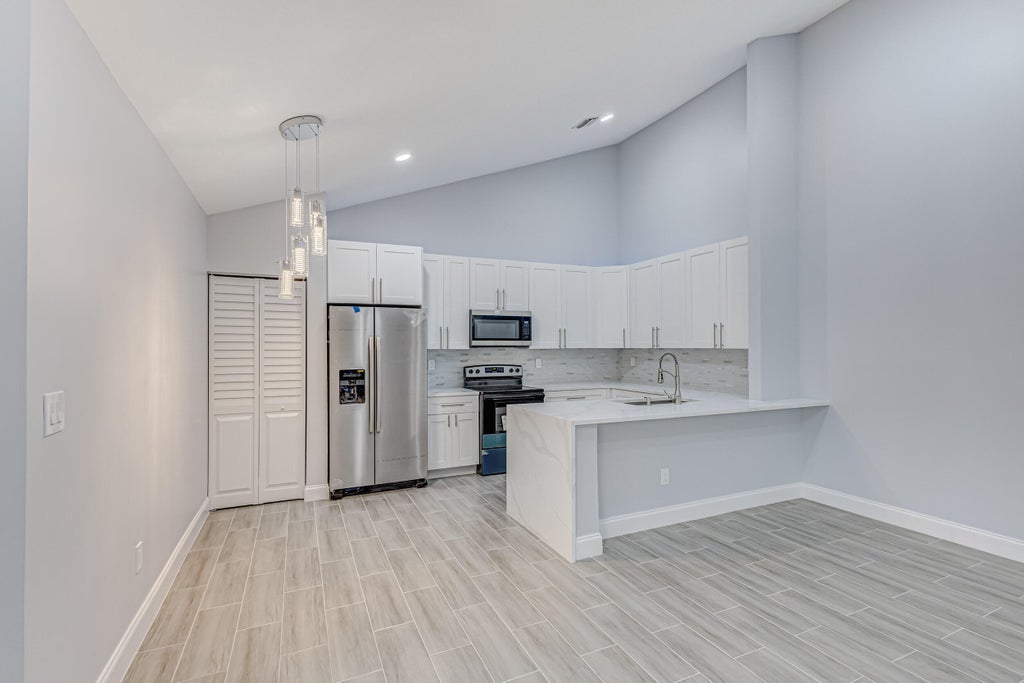 Photo of 1240 SUMMIT PLACE Circle #D, West Palm Beach, FL 33415 (MLS # B26076503)
