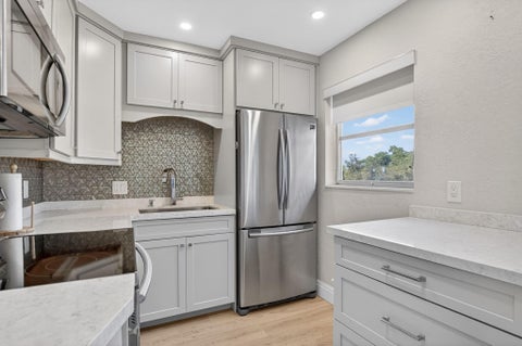 Tiny photo for 941 CRYSTAL LAKE Drive #311, Deerfield Beach, FL 33064 (MLS # B26084659)