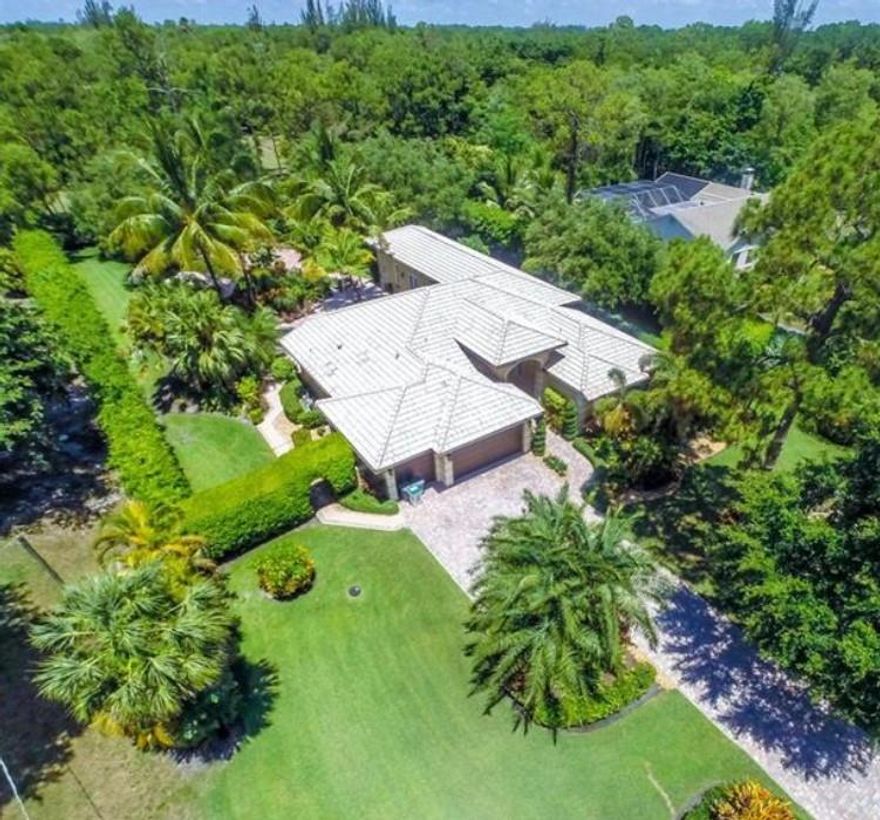 This Beautiful Home is in Pine Tree Estates and is sited on 1.09 acre, allowing for private and serene outdoor living spaces. Impressive curb appeal with an expansive front lawn, glass double door entry and a long drive. An epicurean kitchen with fine wood cabinetry, top shelf appliances and granite. The backyard and pool area are magical. Offerings: wood and marble floors, impact windows/doors, pool with spa and horses are allowed.