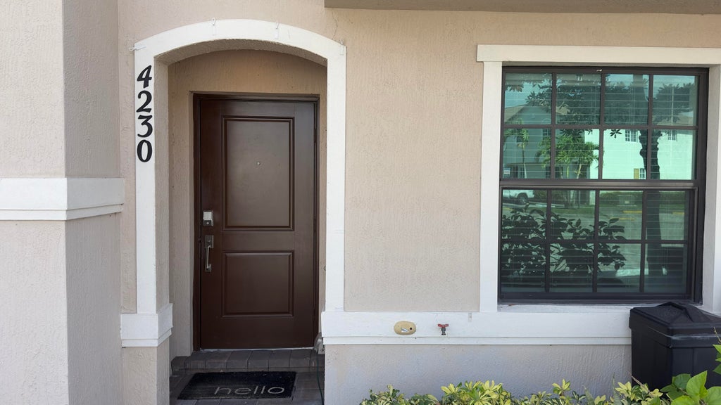 Photo of 4230 NAPOLI LAKE Drive, Riviera Beach, FL 33410 (MLS # B26067984)