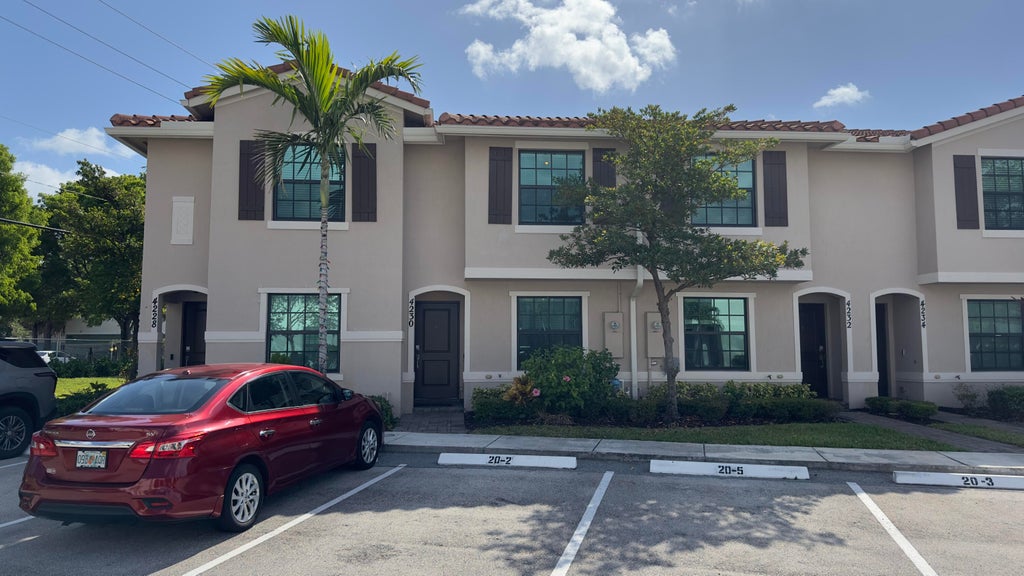 Photo of 4230 NAPOLI LAKE Drive, Riviera Beach, FL 33410 (MLS # B26067984)