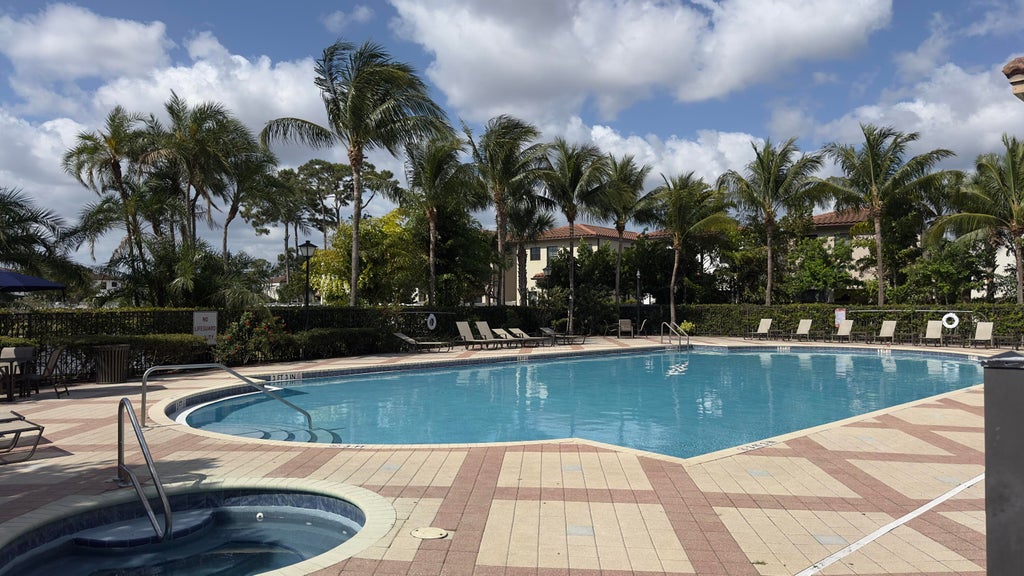 Photo of 4230 NAPOLI LAKE Drive, Riviera Beach, FL 33410 (MLS # B26067984)