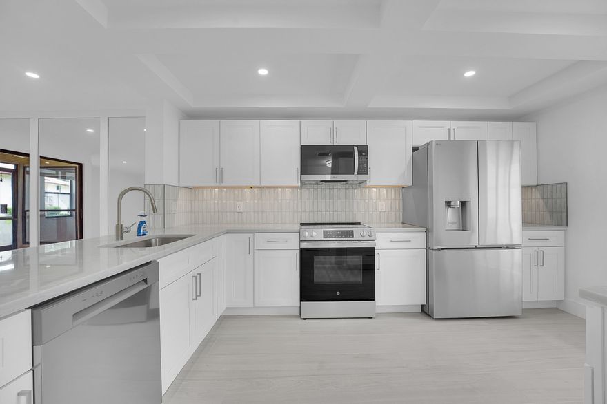 Owner financing available! Amazing 2/2 first floor condo, complete renovation just completed.  Everything is new and beautiful. Gorgeous new kitchen with brand new appliances and quartz countertops.  The whole place is light and bright and very well done.  Check it out!