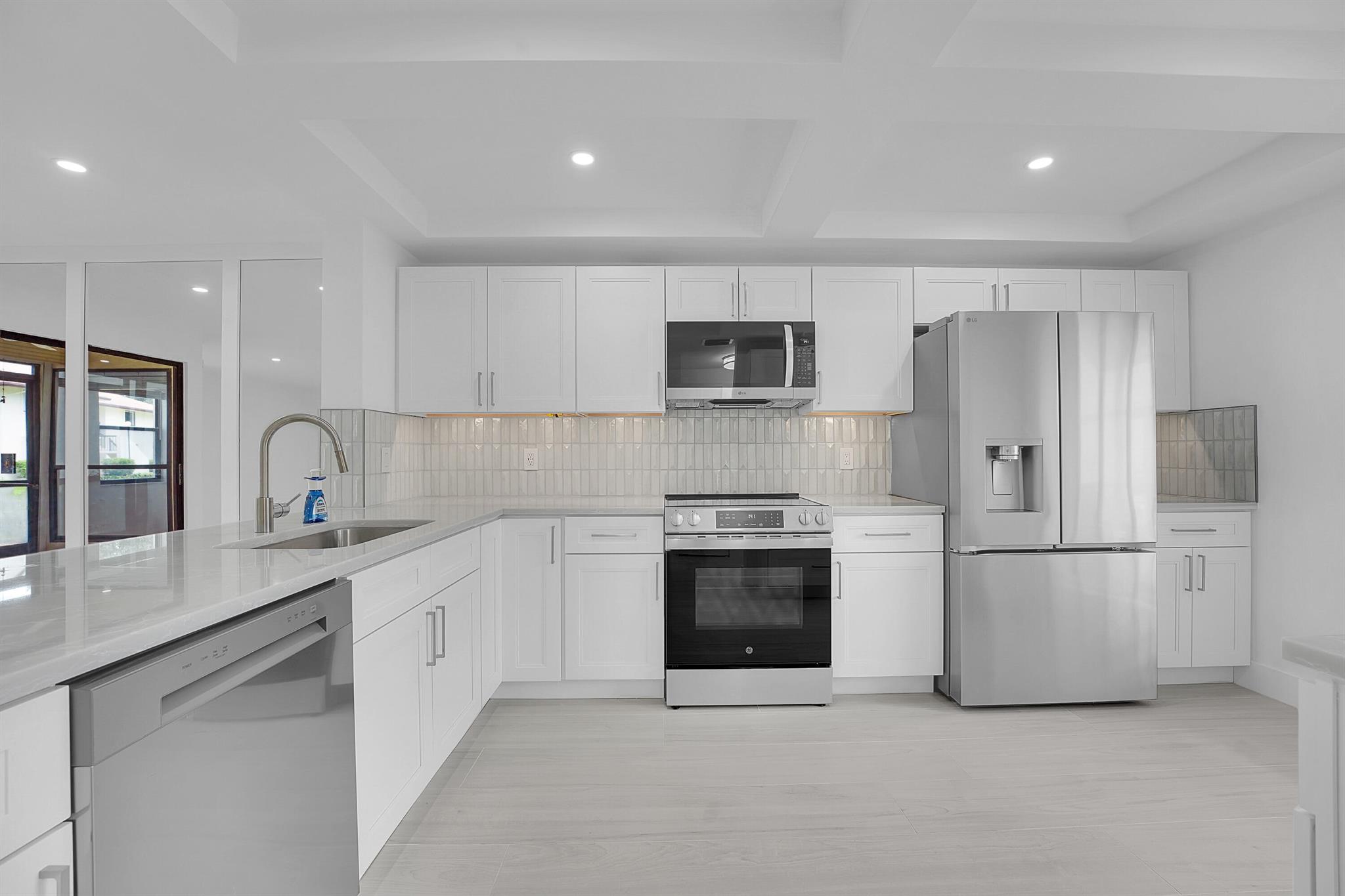 Amazing 2/2 first floor condo, complete renovation just completed. Everything is new and beautiful. Gorgeous new kitchen with brand new appliances and quartz countertops. The whole place is light and bright and very well done. Check it out!